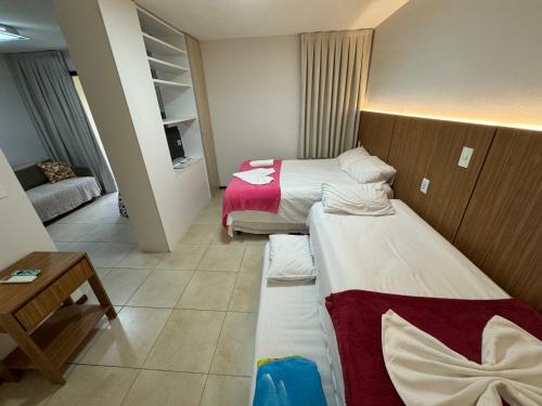 Una cama o camas en una habitación de Solar de Pipa Elegance Flat - Frente Piscina