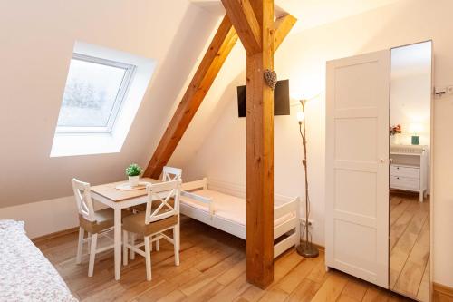 a small room with a table and a dining room at Resort Mlýn Karolínka in Vranov nad Dyjí