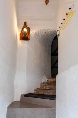 a stairway with a light fixture on the wall at Resort Mlýn Karolínka in Vranov nad Dyjí