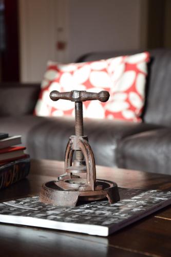 a metal figurine on a table in a living room at Chalet Im Wieselti in Langwies