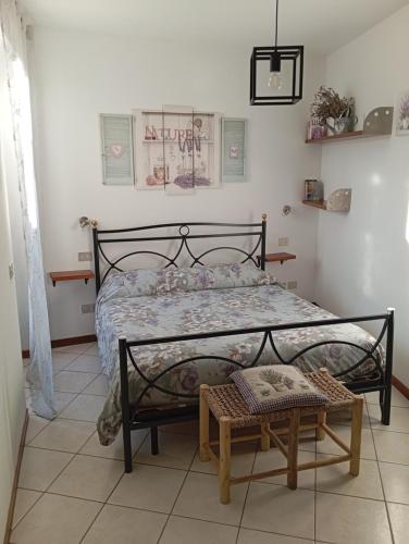 a bedroom with a bed and a table in it at Casa Valletta in Mezzomerico