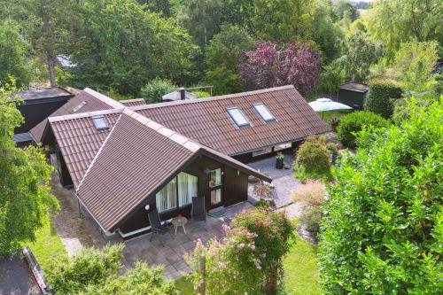 an overhead view of a house with a roof at The Summer House In Peaceful Nyrup in Nykøbing Sjælland