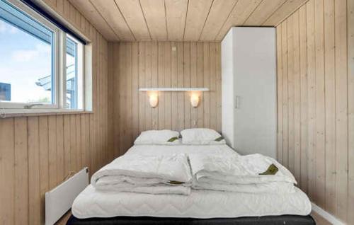 a large bed in a room with a window at Activity House - Flovt Strand, Haderslev in Haderslev