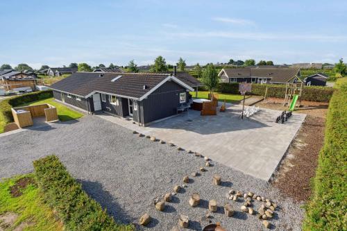 an aerial view of a house with a playground at Activity House - Flovt Strand, Haderslev in Haderslev