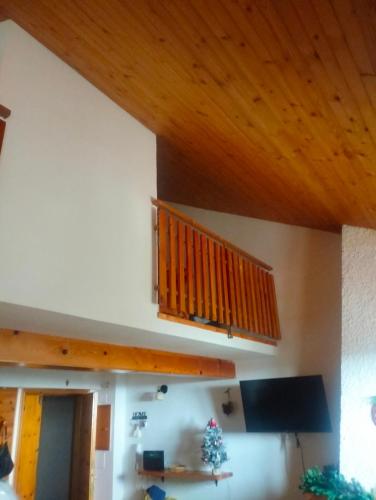 a living room with a wooden ceiling at Erbanova in Sila in Camigliatello Silano