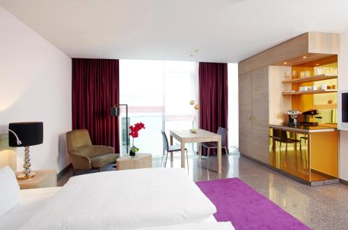 Cama o camas de una habitación en abito Suites
