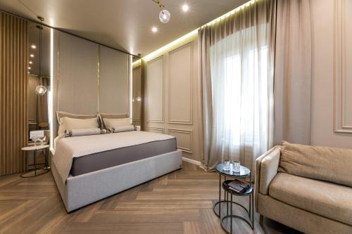 a bedroom with a bed and a couch at K&K2 Luxury Studios in Split