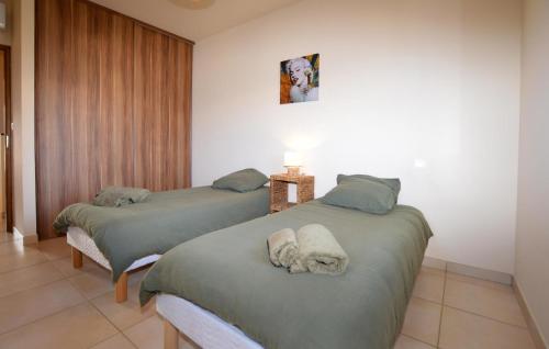 Ein Bett oder Betten in einem Zimmer der Unterkunft Nice Home In Sagone With Wi-Fi