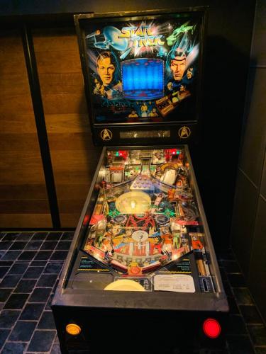 a pinball game in a hotel room at Maisonette jacuzzi terrasse Lille in Saint-André-lez-Lille