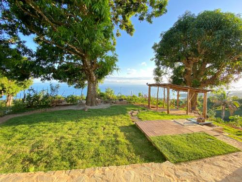 a garden with a gazebo and trees at Apartamento con Vista al Mar PalmeritaVillage in El Valle