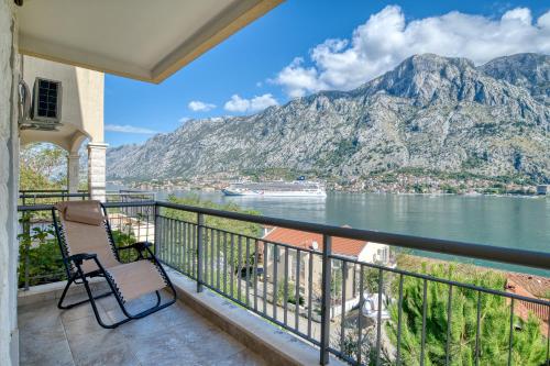 a balcony with a view of the water and mountains at Kotor Vista Seaview apartment by MN Property in Muo
