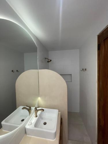 a bathroom with a sink and a mirror at Wao Beach Venao in Playa Venao