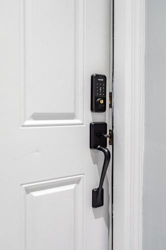 a door with a phone attached to it at Modern Escape 3BR Apt with Parking in New Rochelle