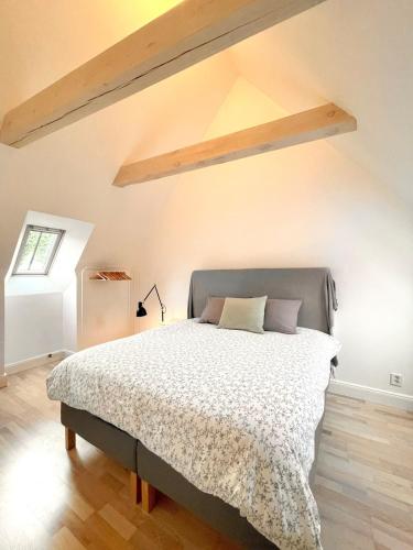 a bedroom with a large bed in a attic at Visby innerstad St Hans in Visby