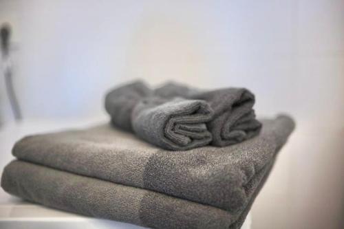 a pile of towels sitting on top of a table at Visby innerstad St Hans in Visby