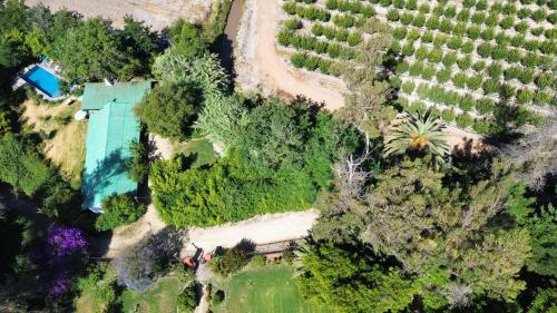 an overhead view of a house in a vineyard at The White House by Casona Lo Aguirre - El Monte RM in Talagante