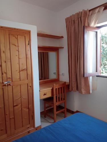 Llit o llits en una habitació de Holiday Maio
