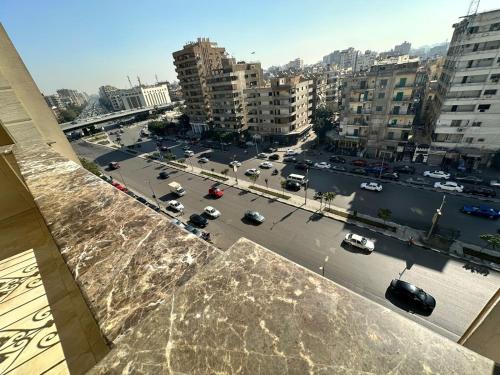 a view of a city with cars on a street at King Palace Rooms in Cairo