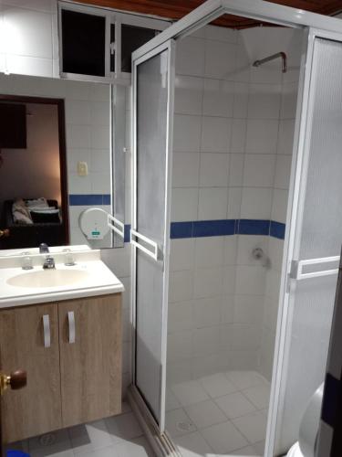 a bathroom with a shower and a sink at hospedaje luna azul in Santa Marta