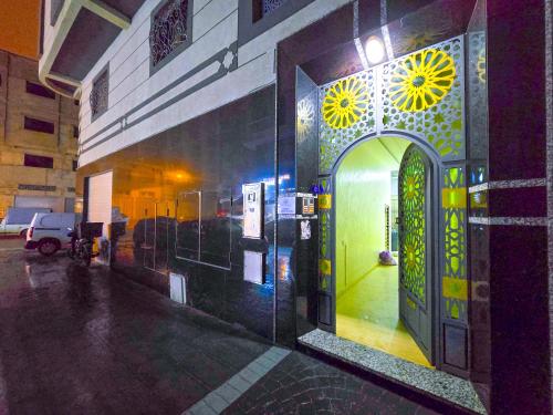 an entrance to a building with a decorated door at Elite Holiday Home - Luxury & Centric Flat in Tangier