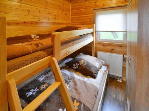 Postel nebo postele na pokoji v ubytování Single-story holiday homes with a terrace, pool