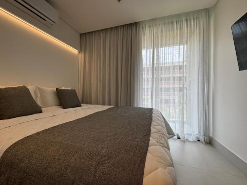 Ένα ή περισσότερα κρεβάτια σε δωμάτιο στο GAV Porto Alto Resort