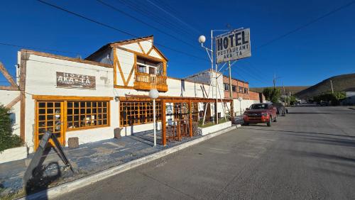 an old building on the side of a street at Hotel y Restaurant AKATA in Río Mayo