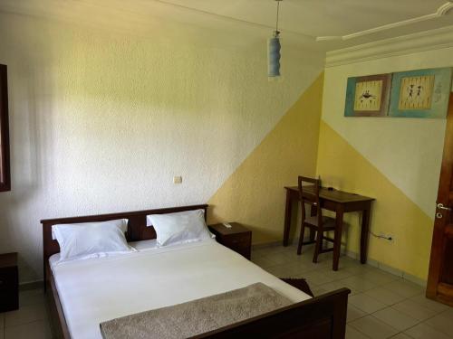 Llit o llits en una habitació de Villa Fely RDC