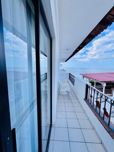 a balcony of a building with a view of the ocean at Tropicana Hotel Puerto Vallarta in Puerto Vallarta