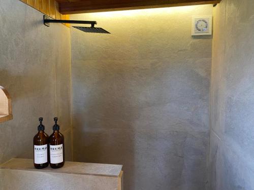 two bottles of wine sitting on a counter in a room at Skema Collections Quito in Quito