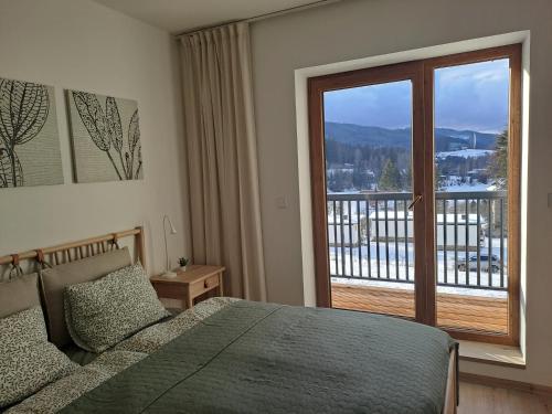 Postel nebo postele na pokoji v ubytování Apartmán Pohoda 18
