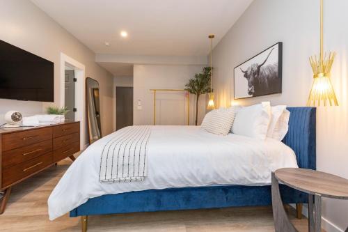 a bedroom with a large bed and a table at The Dogwood in Maggie Valley