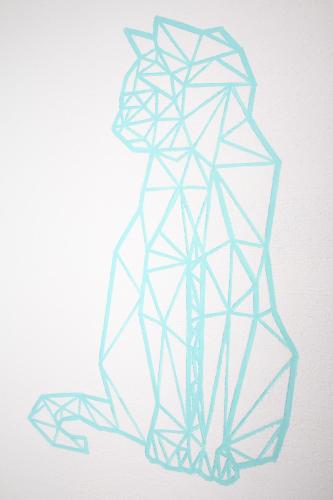 a drawing of a cat in blue at DAM Hotel Pereira in Pereira