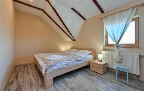 a bedroom with a bed and a large window at Pet Friendly Home In Ivanec With Wifi in Ivanec
