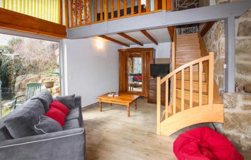 a living room with a couch and a staircase at Stunning Home In Saint Barthélémy-Le-Me in Saint-Barthélemy-le-Meil