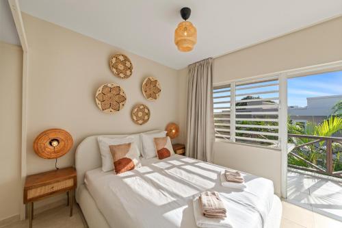 Ένα ή περισσότερα κρεβάτια σε δωμάτιο στο Alma Curacao