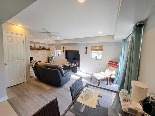 a living room with a couch and a table at Quiet Retreat for Business or Family Trip in Charlotte