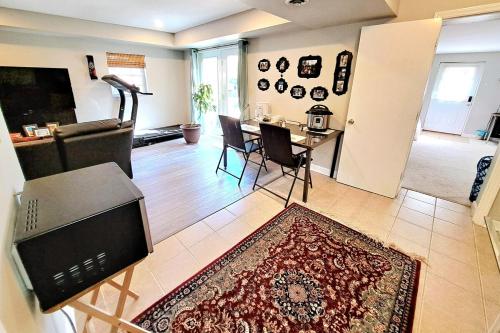 a living room with a table and a dining room at Quiet Retreat for Business or Family Trip in Charlotte