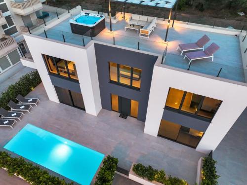 an aerial view of a house with a swimming pool at Villa Magic Sky II in Kraj