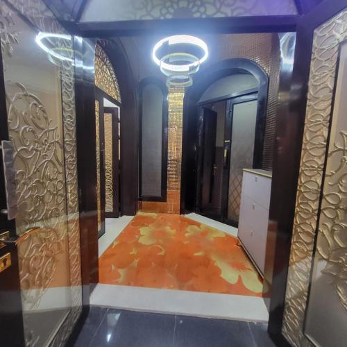 a dressing room with a orange floor and a mirror at Beachfront Holiday Homes in Ajman 