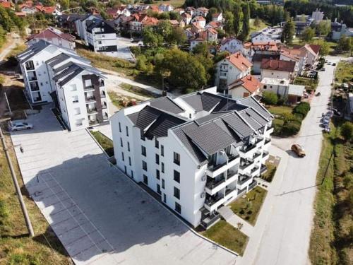 an overhead view of a building with solar panels on it at Apartman Dolce Vita Sokobanja in Soko Banja