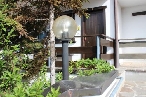 a street light in front of a building at Suite Marco nice apartment in Cavalese with View in Cavalese