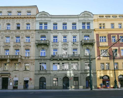 a large building on the side of a street at Four reasons apartment in Prague