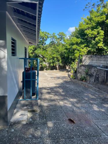 a building with a blue object on the side of a street at Peaceful Private Home With Exclusive Swimming Pool in Montego Bay