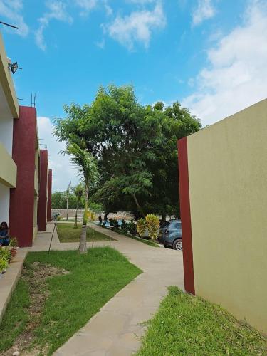 a sidewalk next to a building next to a parking lot at Jade luxury apartments in Galu