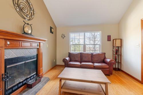 a living room with a couch and a fireplace at Mountain View-Steam Shower-2 Tier Patio- King Bed in Northampton