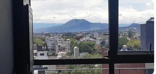 a view of a city from a window at Habitaciones SkY VIEW in Mexico City