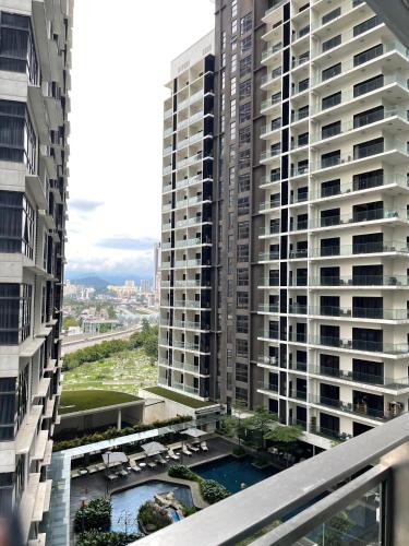 a view from the balcony of a large apartment building at Mercu Summer Suites Bernice KLCC in Kuala Lumpur