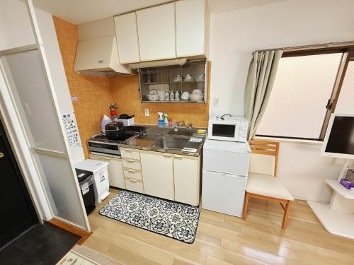 Akazu-hostel newにあるキッチンまたは簡易キッチン