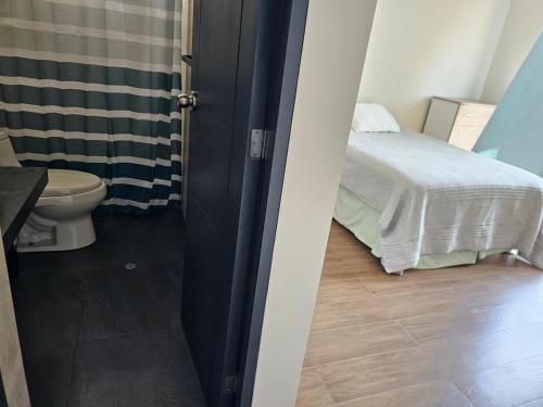 Кровать или кровати в номере Casa en Asia con piscina